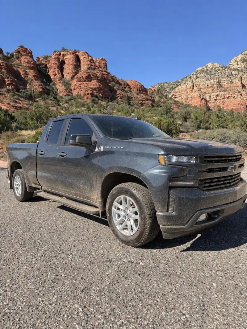 AI-generated illustration of the same Silverado with a light layer of road dust